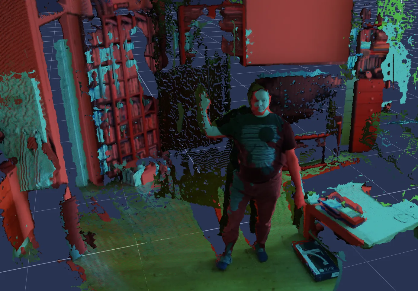 Brekel PointCloud: a room and the person standing in it captured as a dense point cloud, each depth sensor contributing its own colour